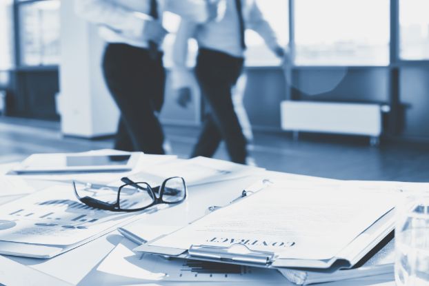 Contract document on a desk with glasses.