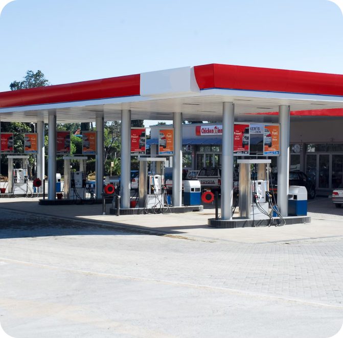 Gas station with pumps and signage.