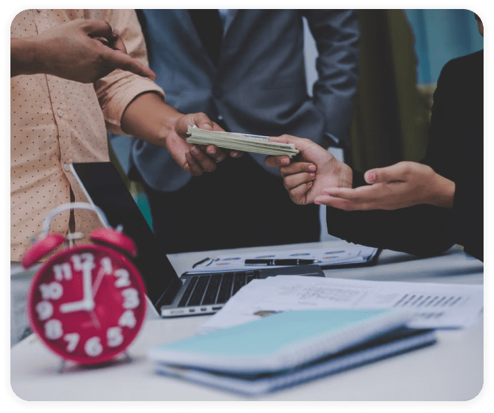 Person hands money to another person.