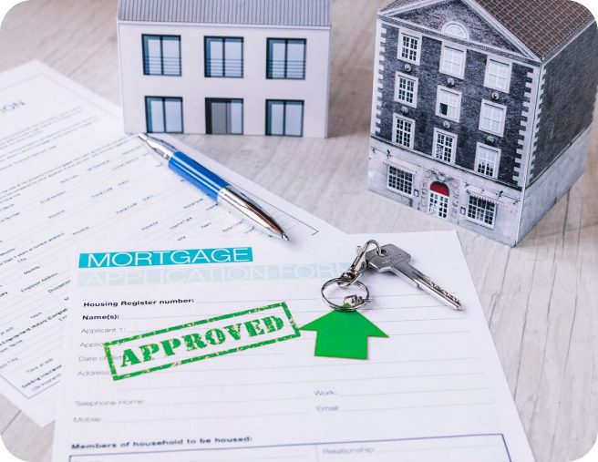 Approved mortgage application with keys and houses.