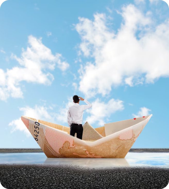 Man in a paper boat made of money.